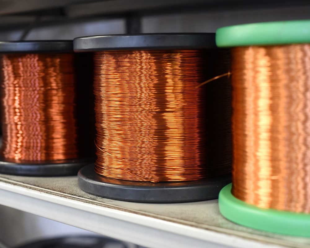 Row of copper wire coils in close up view